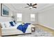 Bright primary bedroom showcasing natural light, carpet floors, and a tray ceiling at 332 Shiloh S Rd, York, SC 29745