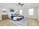 Serene main bedroom featuring a tray ceiling, carpet flooring, and natural light at 332 Shiloh S Rd, York, SC 29745