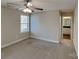 Cozy bedroom with a ceiling fan, neutral walls, and an ensuite bathroom at 3608 Shadowcrest Dr, Concord, NC 28027