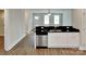 Well-lit kitchen area featuring a dishwasher and seamless countertop space at 3608 Shadowcrest Dr, Concord, NC 28027