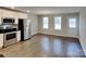 Bright kitchen with stainless steel appliances, a dining area, and access to the backyard at 3608 Shadowcrest Dr, Concord, NC 28027