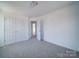 Bedroom featuring closet and door at 502 Geneva Cir, Gastonia, NC 28056
