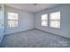 Neutral bedroom with carpet and three windows at 502 Geneva Cir, Gastonia, NC 28056