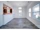An open dining space features gray flooring, white walls, and natural light, complemented by modern pendant lighting at 502 Geneva Cir, Gastonia, NC 28056