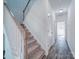 Hallway features carpeted stairs and hardwood floors at 502 Geneva Cir, Gastonia, NC 28056