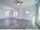 This bright living room offers gray flooring, white walls, and natural light, creating an inviting atmosphere at 502 Geneva Cir, Gastonia, NC 28056
