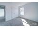 Bright bedroom with carpet, natural light from a window, and closet space at 554 Geneva Cir, Gastonia, NC 28056