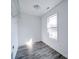 Bedroom with vinyl flooring, bright window view, and neutral colored walls at 554 Geneva Cir, Gastonia, NC 28056