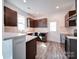 Modern kitchen featuring dark cabinets, stainless steel appliances, and updated countertops at 554 Geneva Cir, Gastonia, NC 28056
