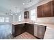A bright kitchen with stainless steel appliances, light countertops, and view into the living area at 554 Geneva Cir, Gastonia, NC 28056