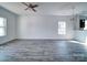 Spacious living room featuring modern flooring and a ceiling fan at 554 Geneva Cir, Gastonia, NC 28056
