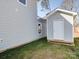 Image featuring the home's exterior and a storage shed with light-grey horizontal siding and white trim at 554 Geneva Cir, Gastonia, NC 28056
