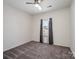 Bedroom featuring carpeted floors, a ceiling fan, and a window with patterned curtains at 6351 Trinity Crossing Cir, Kannapolis, NC 28081