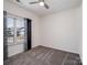 Bedroom featuring carpeted floors, a ceiling fan, and a window with patterned curtains at 6351 Trinity Crossing Cir, Kannapolis, NC 28081