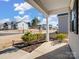 Front porch with shrubs and a view of a residential street at 6351 Trinity Crossing Cir, Kannapolis, NC 28081