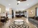 Open-concept living room and kitchen with dark cabinets and a central island at 6351 Trinity Crossing Cir, Kannapolis, NC 28081