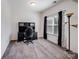 Home office boasts ample natural light and includes a built-in desk and chair for productivity at 6351 Trinity Crossing Cir, Kannapolis, NC 28081