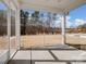 Screened porch with concrete flooring that provides a beautiful view of the backyard at 6351 Trinity Crossing Cir, Kannapolis, NC 28081
