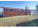 Brick home's backyard with a clothesline at 720 Pleasant Ave, Kannapolis, NC 28081