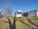 White shed with a porch in the backyard at 720 Pleasant Ave, Kannapolis, NC 28081