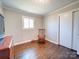Spacious bedroom with hardwood floors and a large closet at 720 Pleasant Ave, Kannapolis, NC 28081
