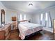 Bedroom with a large bed, dresser and hardwood floors at 720 Pleasant Ave, Kannapolis, NC 28081