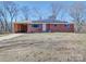 Brick ranch house with solar panels and carport at 720 Pleasant Ave, Kannapolis, NC 28081