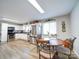 Eat-in kitchen with stainless steel appliances and light wood laminate floors at 720 Pleasant Ave, Kannapolis, NC 28081