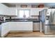 White kitchen with stainless steel appliances at 720 Pleasant Ave, Kannapolis, NC 28081