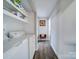 Laundry room with washer, dryer, and ample storage shelves at 720 Pleasant Ave, Kannapolis, NC 28081