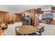 Finished basement with brick fireplace and table at 906 Harmony Dr, Statesville, NC 28677