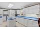 White kitchen with blue countertops and kitchen island at 906 Harmony Dr, Statesville, NC 28677