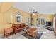Living room with a leather couch, coffee table and access to a deck at 906 Harmony Dr, Statesville, NC 28677