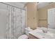 Cozy bathroom featuring a shower and tub combo and white toilet and sink at 11402 Bloomfield Dr, Charlotte, NC 28277