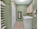 The laundry room provides a washer and dryer with built in storage at 11402 Bloomfield Dr, Charlotte, NC 28277