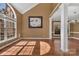 Open living area featuring hardwood floors, high ceilings, and abundant natural light at 11402 Bloomfield Dr, Charlotte, NC 28277