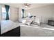 Bright bedroom with large windows, a ceiling fan, and neutral colors, creating a serene and inviting space at 12712 Wandering Brook Dr, Charlotte, NC 28273