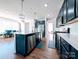 Stylish kitchen with a center island, pendant lighting, and stainless steel appliances at 12712 Wandering Brook Dr, Charlotte, NC 28273