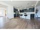 Open kitchen with large center island, stainless steel appliances, and ample cabinet space at 12712 Wandering Brook Dr, Charlotte, NC 28273