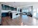 Modern kitchen featuring an island with bar stools, stainless appliances, and an open layout at 12712 Wandering Brook Dr, Charlotte, NC 28273
