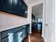 Modern kitchen with sleek dark cabinets, white countertops, and a subway tile backsplash at 12712 Wandering Brook Dr, Charlotte, NC 28273