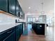 Contemporary kitchen with an island, stainless steel appliances, and an open layout at 12712 Wandering Brook Dr, Charlotte, NC 28273