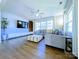 Bright living room with large sectional sofa and decorative accents at 12712 Wandering Brook Dr, Charlotte, NC 28273