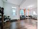 Inviting living room with hardwood floors, decorative lighting, and a bright, airy feel at 12712 Wandering Brook Dr, Charlotte, NC 28273