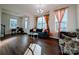 Spacious living room with an open layout, hardwood floors, and stylish furnishings at 12712 Wandering Brook Dr, Charlotte, NC 28273