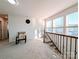 Cozy upstairs loft space with a chair and lots of natural light at 12712 Wandering Brook Dr, Charlotte, NC 28273