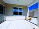 Covered patio features a concrete floor and view of the adjacent home and is ready for your outdoor furniture at 12712 Wandering Brook Dr, Charlotte, NC 28273