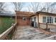 View of back deck with pergola, grill, and wood railings at 128 Summerlea Dr, Charlotte, NC 28214
