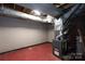 Unfinished basement area with exposed pipes and Goodman furnace at 128 Summerlea Dr, Charlotte, NC 28214