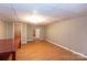 Spacious basement with wood-look flooring at 128 Summerlea Dr, Charlotte, NC 28214